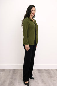 Side view of a woman in a comfortable green collared sweater displaying a fitted silhouette with natural stretch.