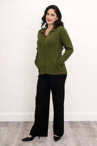 Three-quarter front view of a woman wearing a classic buttoned olive knit shirt sweater.