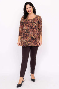Woman standing and smiling in a leopard print bamboo 3/4 sleeve tunic top