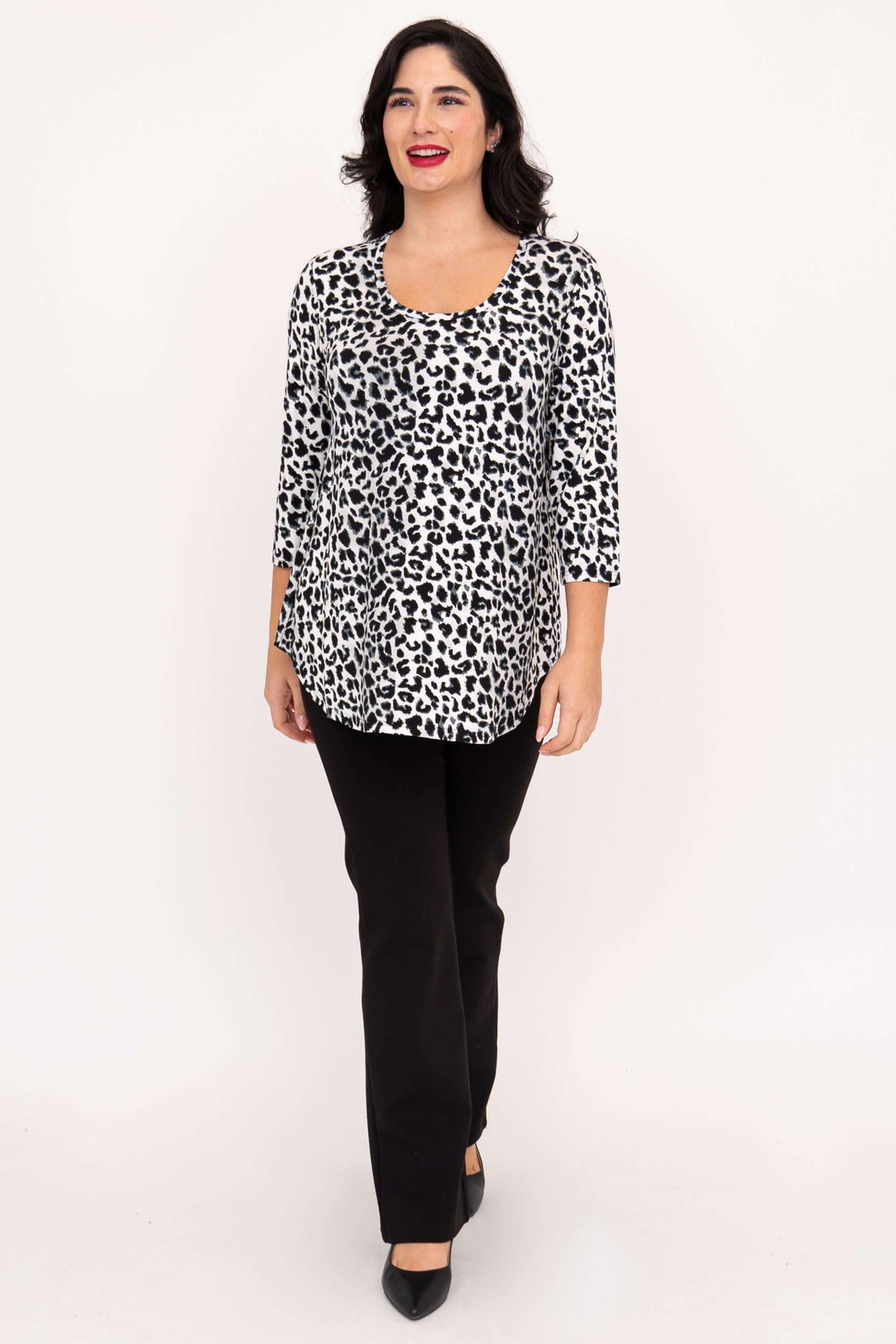 Model walking in snow leopard print bamboo top with 3/4 sleeves and black pants