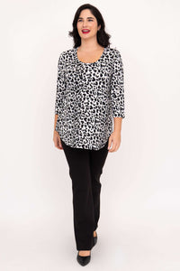 Model walking in snow leopard print bamboo top with 3/4 sleeves and black pants