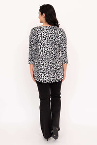Back view of model wearing snow leopard print bamboo top with 3/4 sleeves