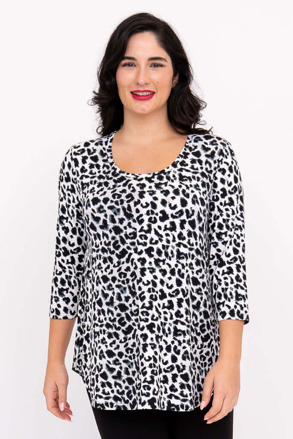 Front view of model wearing a snow leopard print 3/4 sleeve bamboo top