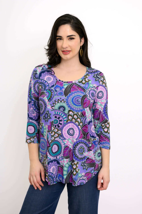 Woman wearing bamboo Jazz 3/4 Sleeve Top in Carnival print, front view, smiling