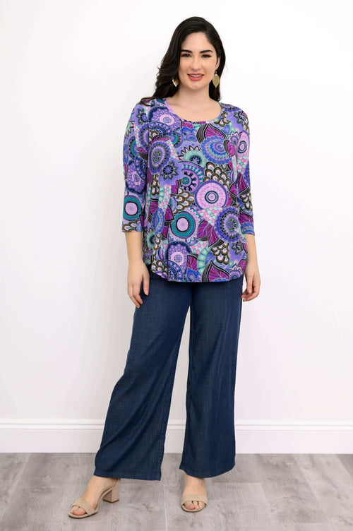 Woman modeling Jazz 3/4 Sleeve Top in Carnival print, full body front view