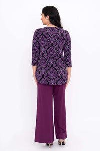Back view of Jazz 3/4 Sleeve Top in Damask Purple on model with purple pants