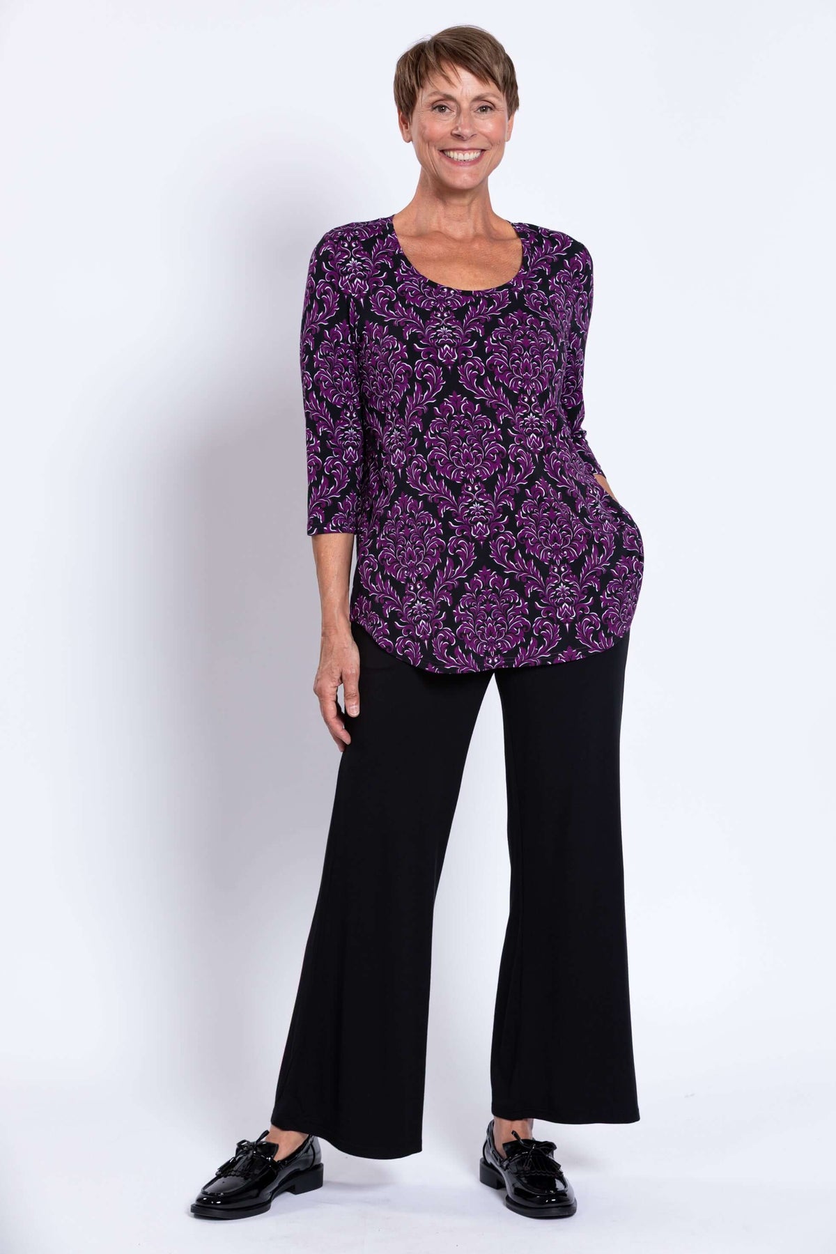 Full view of Jazz 3/4 Sleeve Top in Damask Purple paired with black pants