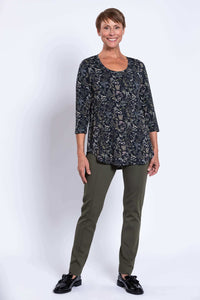 Full body front view of woman modeling Jazz 3/4 sleeve bamboo top with floral pattern