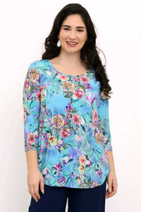 Front view of woman wearing blue floral 3/4 sleeve bamboo top