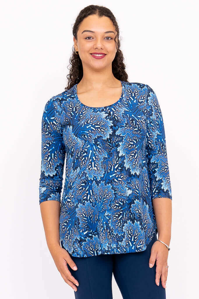 Front view of model wearing blue patterned 3/4 sleeve bamboo top
