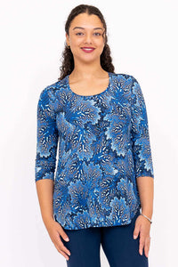 Front view of model wearing blue patterned 3/4 sleeve bamboo top