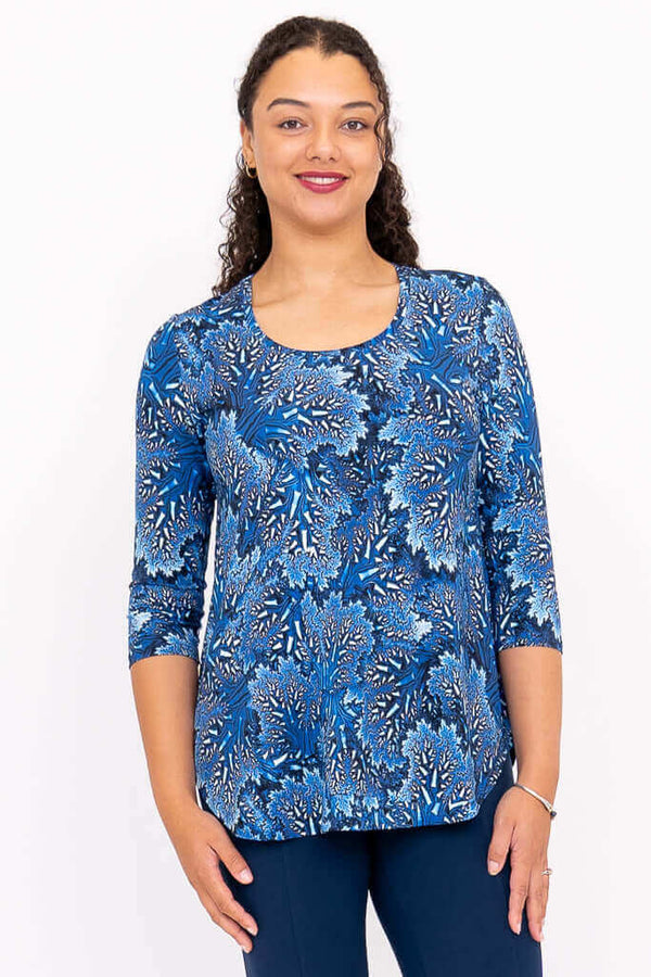 Front view of model wearing blue patterned 3/4 sleeve bamboo top