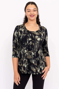 Woman wearing a black and olive abstract print 3/4 sleeve bamboo top