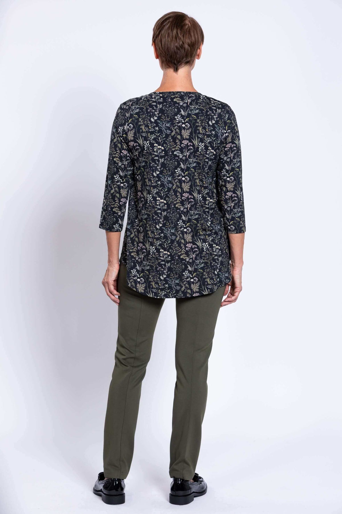 Back view of Jazz 3/4 sleeve bamboo top in forest floral print worn by model