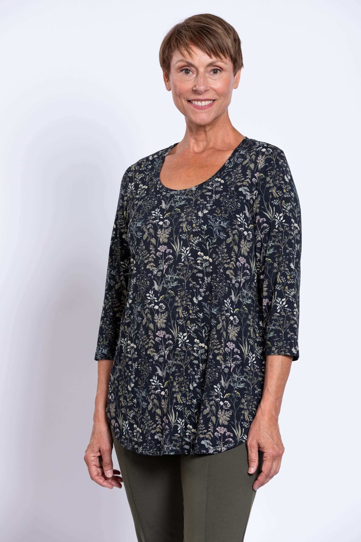 Three-quarter front view of woman in Jazz 3/4 sleeve bamboo top, floral print
