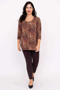Full length view of a woman in a leopard print 3/4 sleeve bamboo top and brown pants