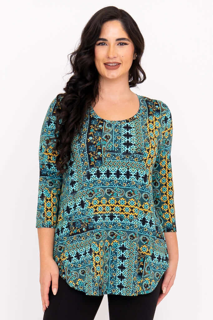Woman wearing a turquoise mosaic print 3/4 sleeve bamboo top, front view