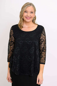 Close-up of woman wearing black lace top with 3/4 sleeves and scoop neckline