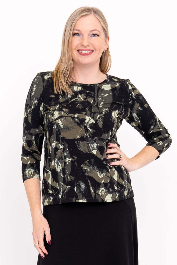 Woman wearing olive and black brush print fitted tee with 3/4 sleeves, front view