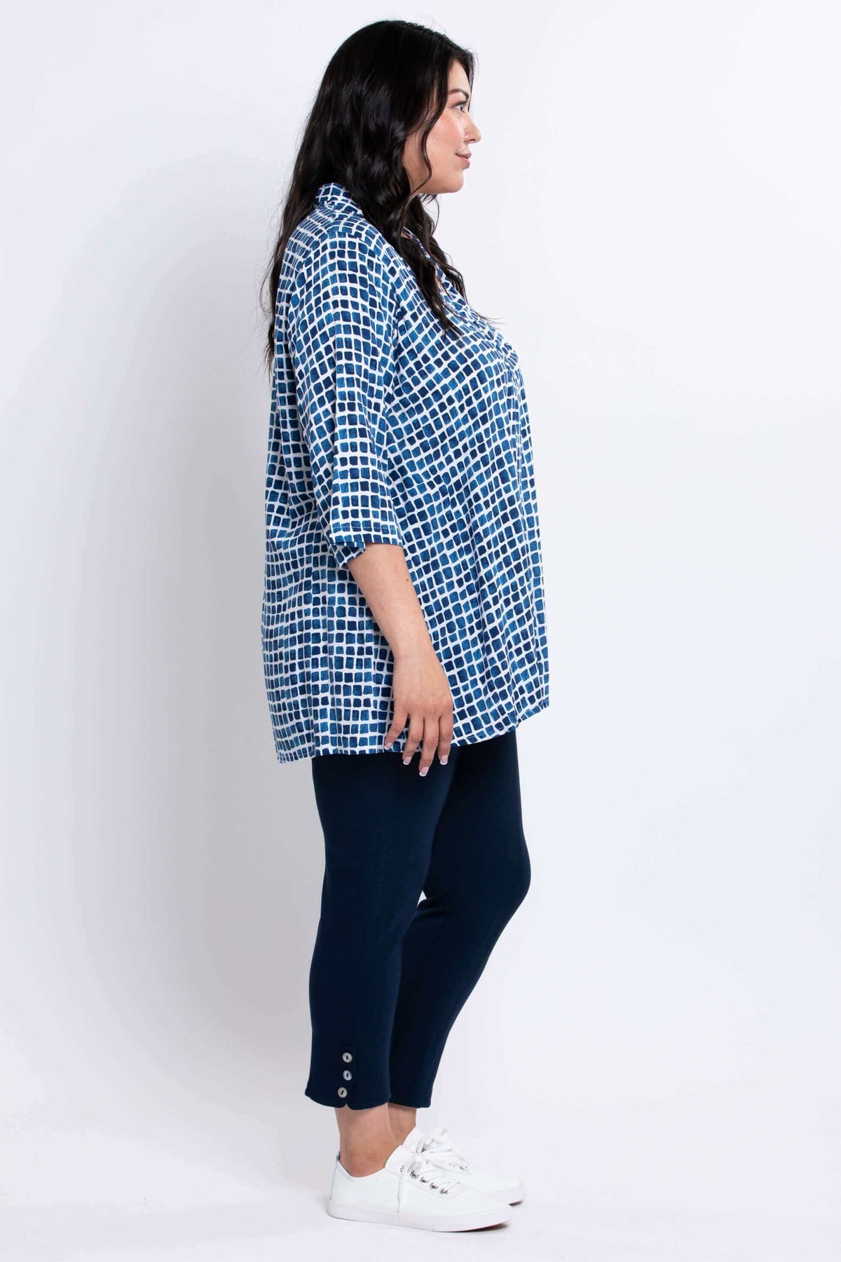 Side view of model showcasing blue batik Shirley blouse with 3/4 sleeves