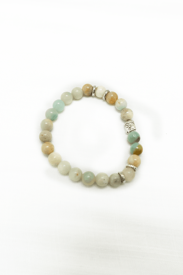 Beaded amazonite bracelet with silver accents and tranquil blue-green stones on white background