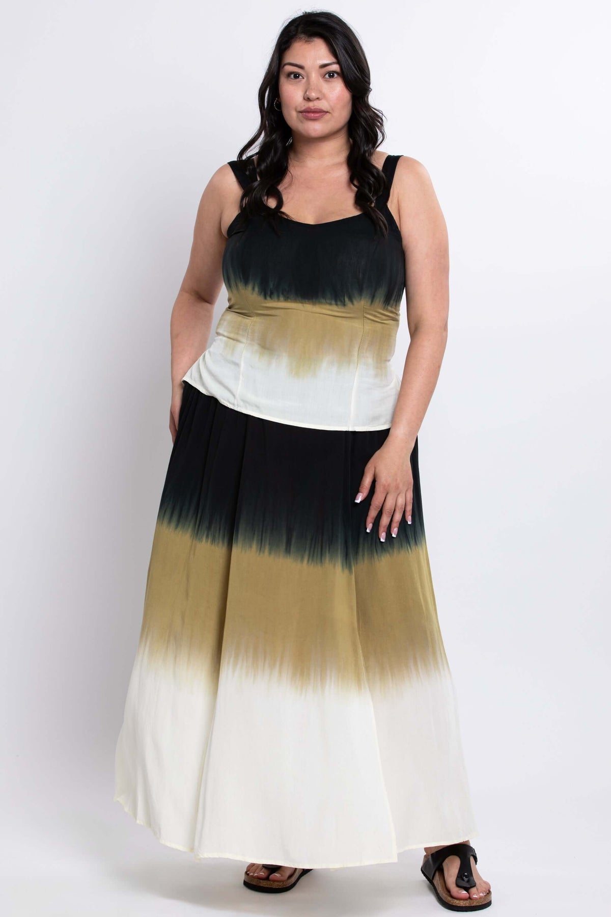 Angled front view of model in dip dye tank top and matching skirt