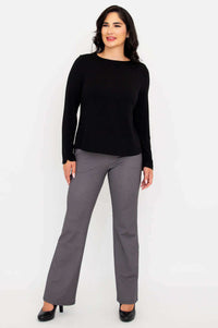 Full body angled front view of woman in Mona boat neck top and check pants