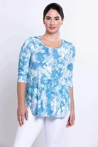 Front angled view of model in blue watercolor bamboo top with 3/4 sleeves