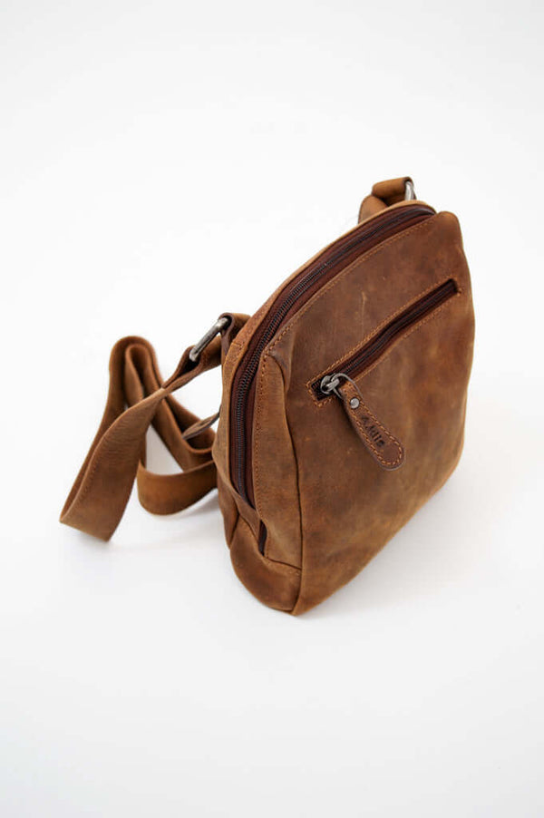 Angled top view of the vintage brown leather crossbody bag showing zipper