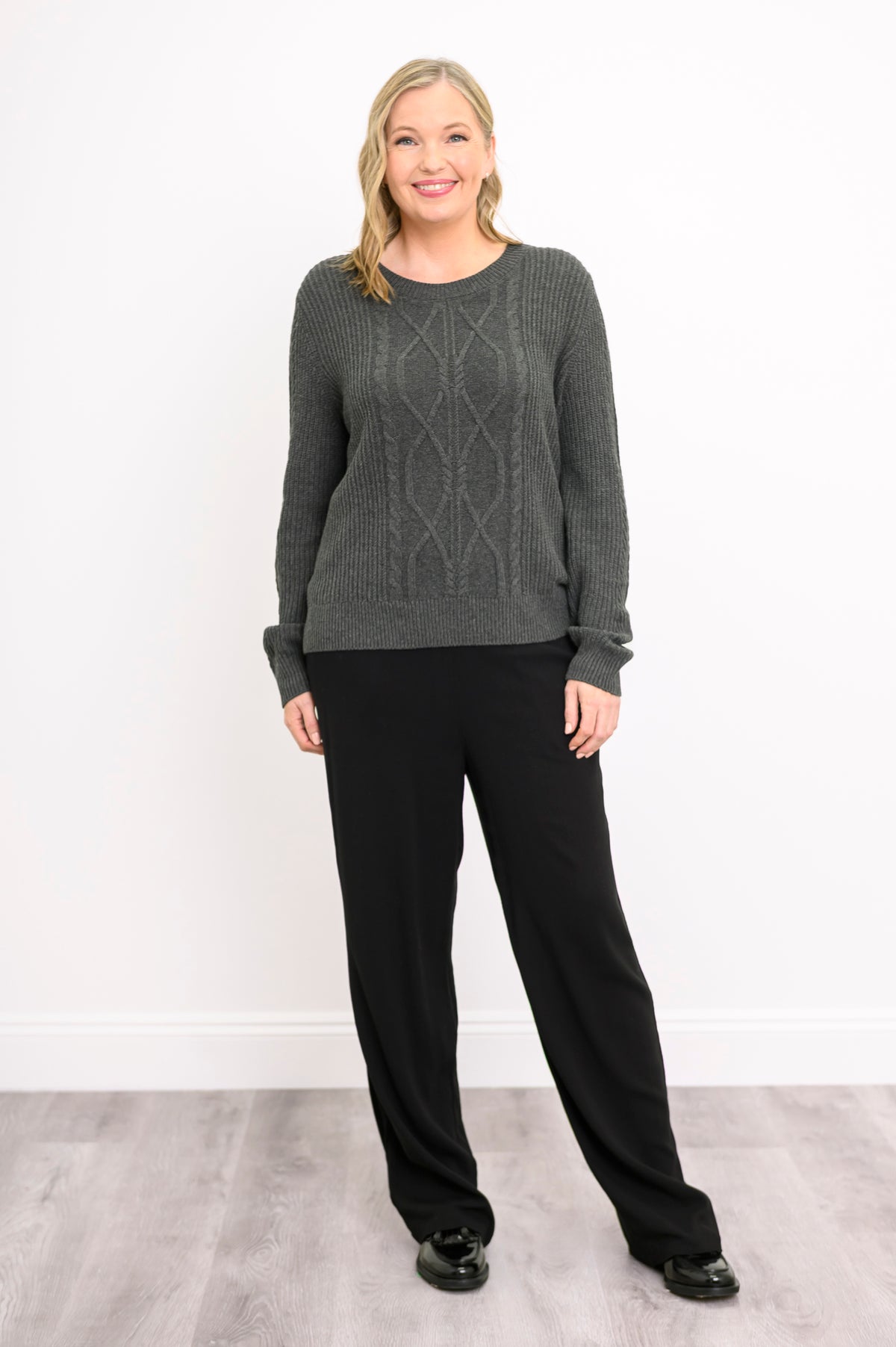 Front-facing shot of a graphite patterned sweater, illustrating a comfortable, relaxed-fit drape.