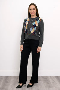 full body front view of woman in grey argyle cardigan with multicolor print
