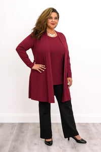 Full-length front view of a woman styling an open wine red bamboo cardigan with a matching burgundy top and black pants.