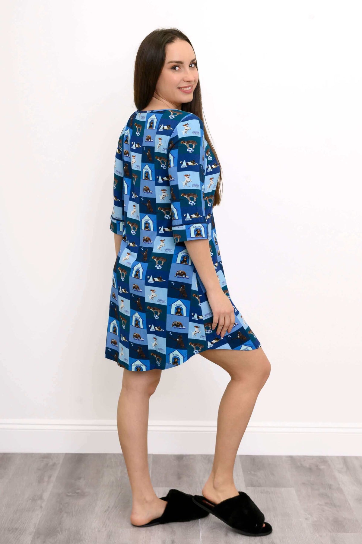Back-side view of woman modeling blue dog print sleepshirt