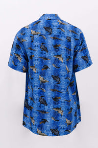 Back view of blue collared shirt with crocodile and alligator print