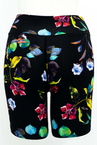 Back view of black bamboo shorts adorned with colorful floral prints