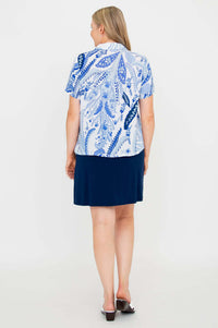 Back view of blue paisley Lala top paired with navy skirt