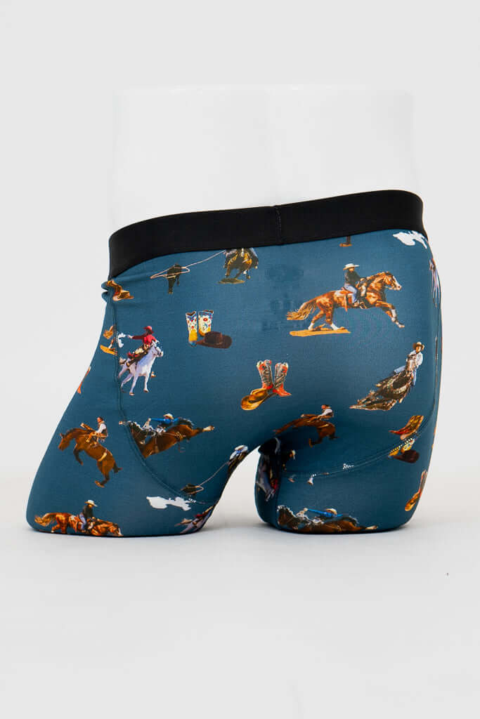 Back view of men's blue bamboo underwear with Western-themed cowboy and boots print