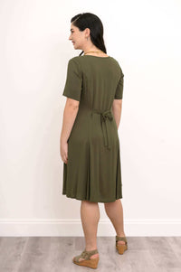 Back view of olive green dress showing tie belt detail at waist