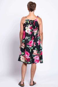 Back view of floral print beach dress with single tie strap detail