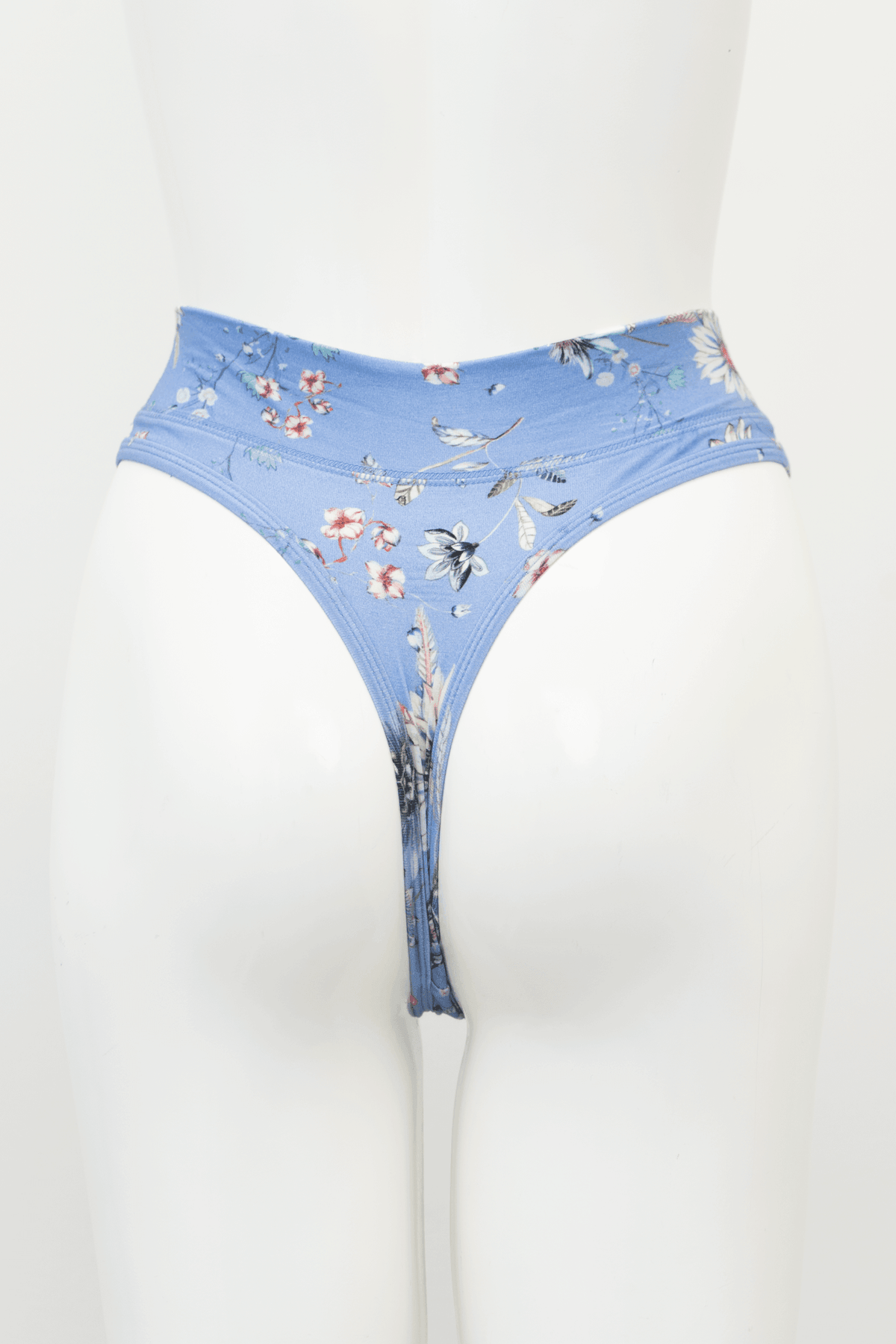 Back view of a blue floral high rise bamboo thong on mannequin