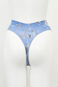 Back view of a blue floral high rise bamboo thong on mannequin