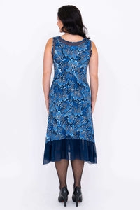 Back view of blue sleeveless dress with mesh hem and floral pattern