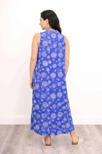 Back view of model in blue sleeveless dress with white swirl patterns