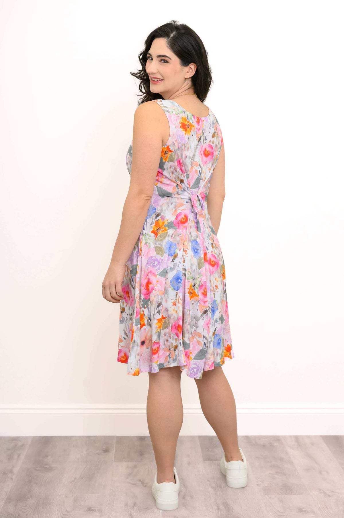 Back view of floral dress with tie-belt detail