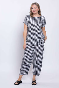 Back view of a woman wearing the gingham linen blend tee and pants set