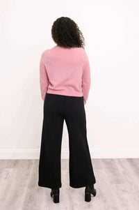 Back view of a woman showcasing the cardigan's fit