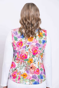 Back view of woman wearing a sleeveless pink floral vest
