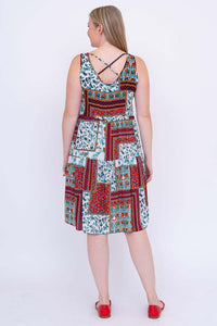 Back view of woman showing criss-cross strap detail on patchwork summer dress
