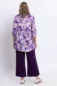 Back view showing the floral tunic and relaxed fit on model