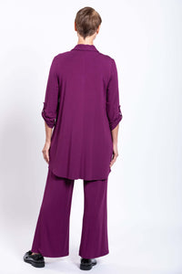Back view of model in plum bamboo tunic blouse and matching pants